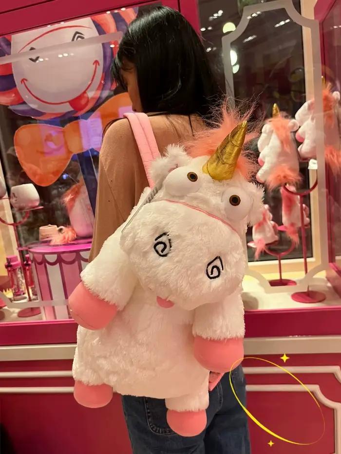 Poupée en peluche licorne originale Universal Studios, un sac à dos coussin/oreiller doux, idéal comme cadeau d'anniversaire et souvenir pour les filles