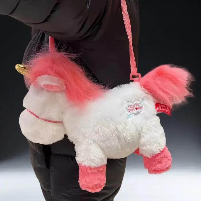 Poupée en peluche licorne originale Universal Studios, un sac à dos coussin/oreiller doux, idéal comme cadeau d'anniversaire et souvenir pour les filles