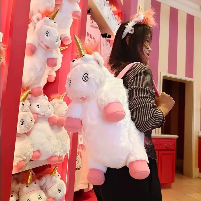 Poupée en peluche licorne originale Universal Studios, un sac à dos coussin/oreiller doux, idéal comme cadeau d'anniversaire et souvenir pour les filles